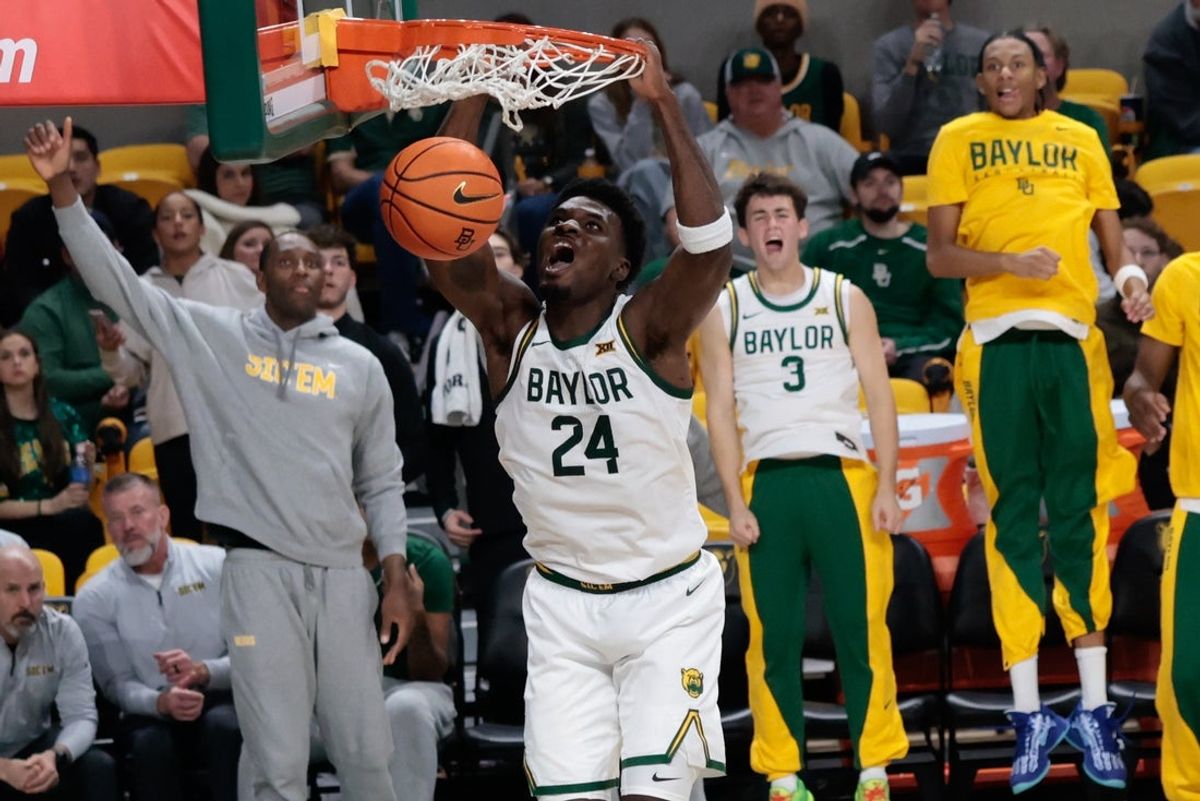 Dec 2, 2025; Waco, Texas, USA;  Baylor Bears guard Tounde Yessoufou (24) dunks the ball against the Sacramento State Hornets during the second half at Paul and Alejandra Foster Pavilion. Mandatory Credit: Chris Jones-Imagn Images