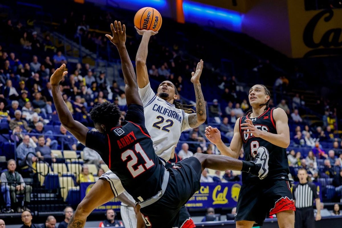 Dec 2, 2025; Berkeley, California, USA; California Golden Bears forward Chris Bell (22) puts up a shot during the first half against the Utah Utes at Haas Pavilion. Mandatory Credit: Bob Kupbens-Imagn Images