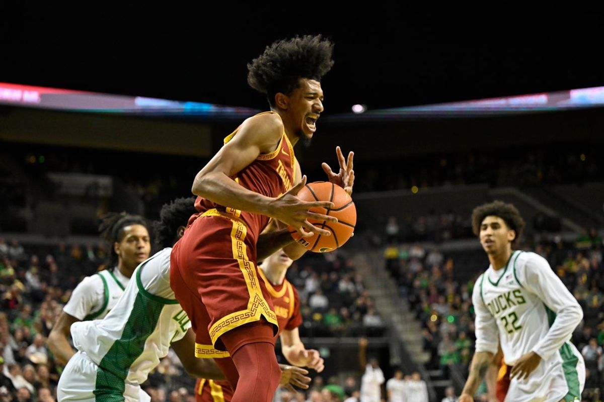 Dec 2, 2025; Eugene, Oregon, USA; Southern California Trojans forward Chad Baker-Mazara (4) grabs a rebound during the first half against the Oregon Ducks at Matthew Knight Arena. Mandatory Credit: Craig Strobeck-Imagn Images