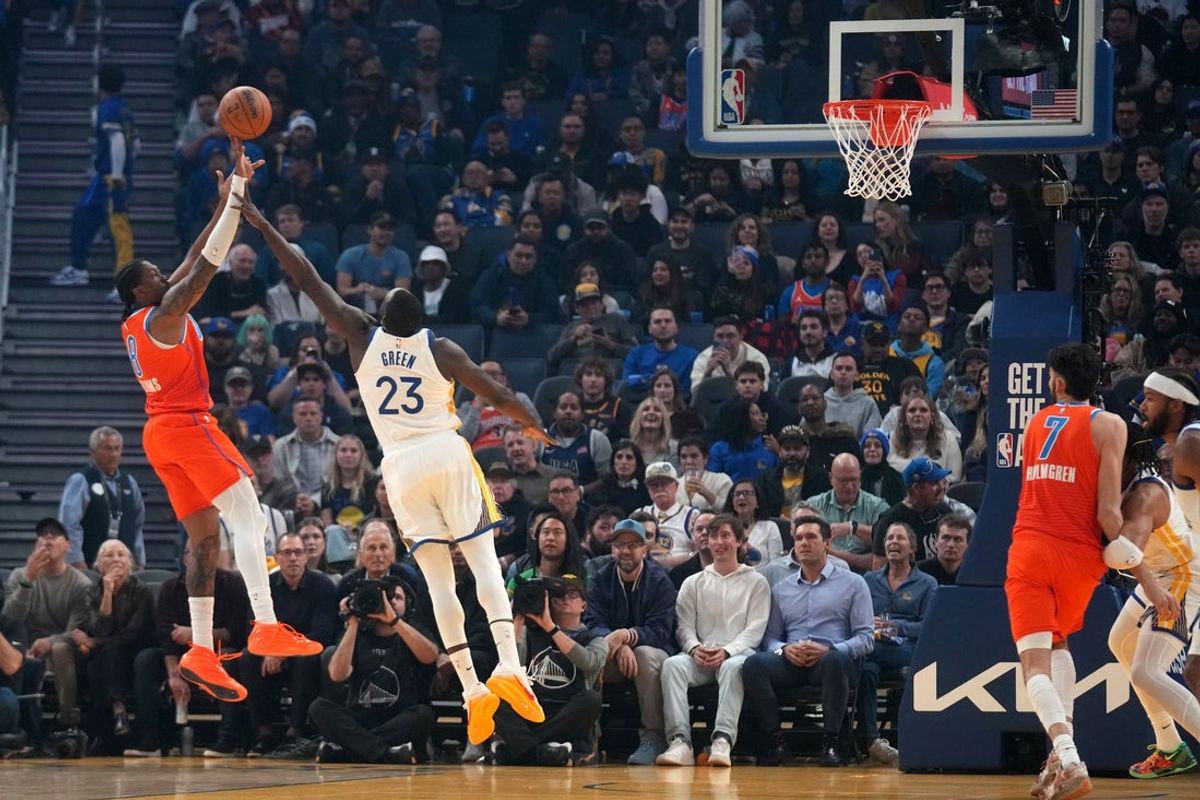 Dec 2, 2025; San Francisco, California, USA; Oklahoma City Thunder guard Jalen Williams (8) makes a shot over Golden State Warriors forward Draymond Green (23) in the first quarter at the Chase Center. Mandatory Credit: Cary Edmondson-Imagn Images