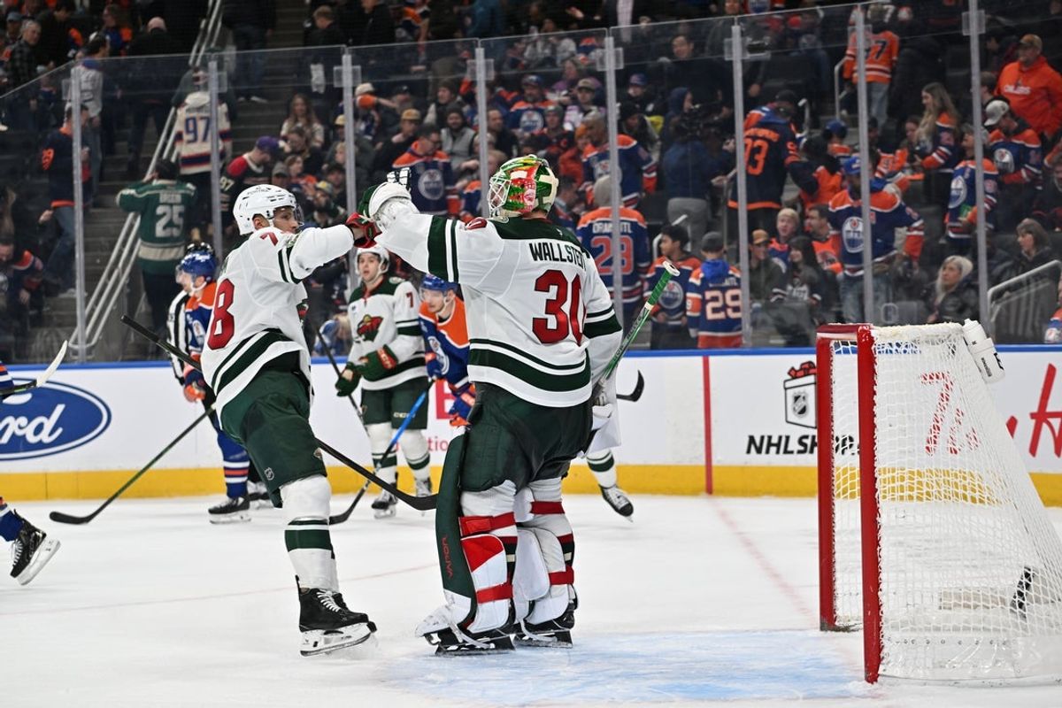 Dec 2, 2025; Edmonton, Alberta, CAN;   Minnesota Wild center Nico Sturm (78) and goalie Jesper Wallstedt (30) celebrate their win during the third period at Rogers Place. Mandatory Credit: Walter Tychnowicz-Imagn Images