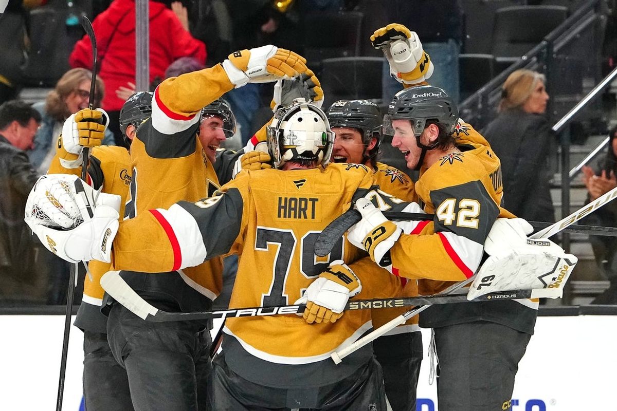 Dec 2, 2025; Las Vegas, Nevada, USA; Vegas Golden Knights goaltender Carter Hart (79) celebrates with team mates after the Golden Knights defeated the Chicago Blackhawks 4-3 in a shoot out at T-Mobile Arena. Mandatory Credit: Stephen R. Sylvanie-Imagn Images