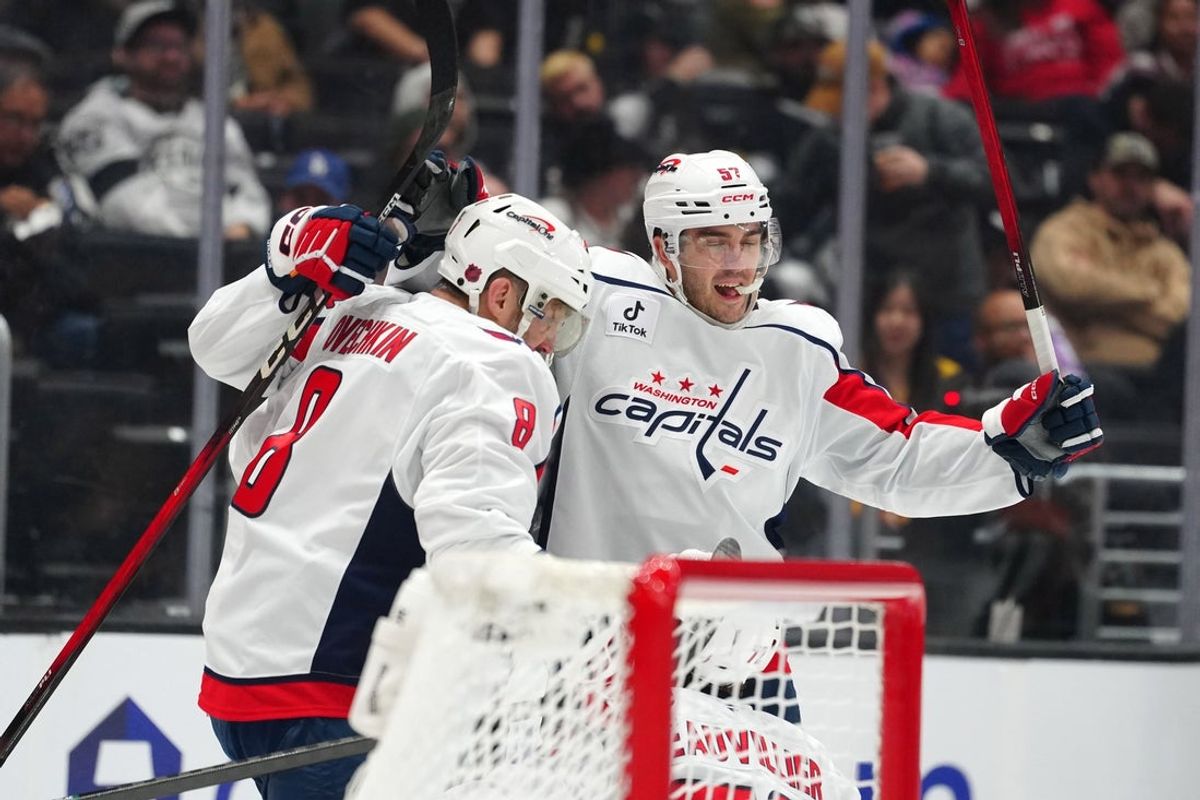 Dec 2, 2025; Los Angeles, California, USA; Washington Capitals defenseman Trevor van Riemsdyk (57) and left wing Alex Ovechkin (8) celebrate after a goal against the LA Kings in the third period at Crypto.com Arena. Mandatory Credit: Kirby Lee-Imagn Images