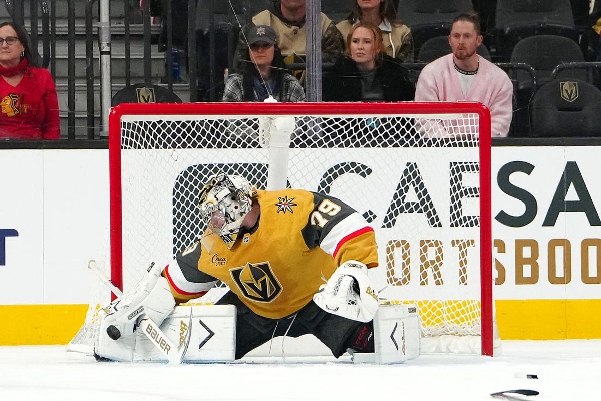 Dec 2, 2025; Las Vegas, Nevada, USA; Vegas Golden Knights goaltender Carter Hart (79) makes a save against the Chicago Blackhawks during an overtime period at T-Mobile Arena. Mandatory Credit: Stephen R. Sylvanie-Imagn Images