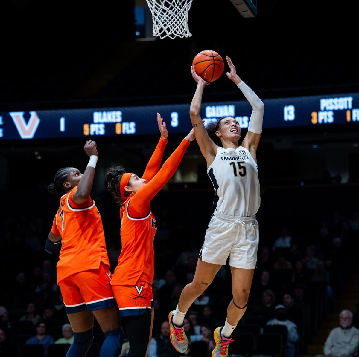 Virginia Cavaliers forward Tabitha Amanze (7) and Virginia Cavaliers guard Jillian Brown (4) guard as Vanderbilt Commodores guard Ndjakalenga Mwenentanda (15) goes up for a layup during the women’s basketball game between the Vanderbilt Commodores and Virginia Cavaliers at Vanderbilt's Memorial Gymnasium in Nashville on Wednesday, Dec. 3, 2025.