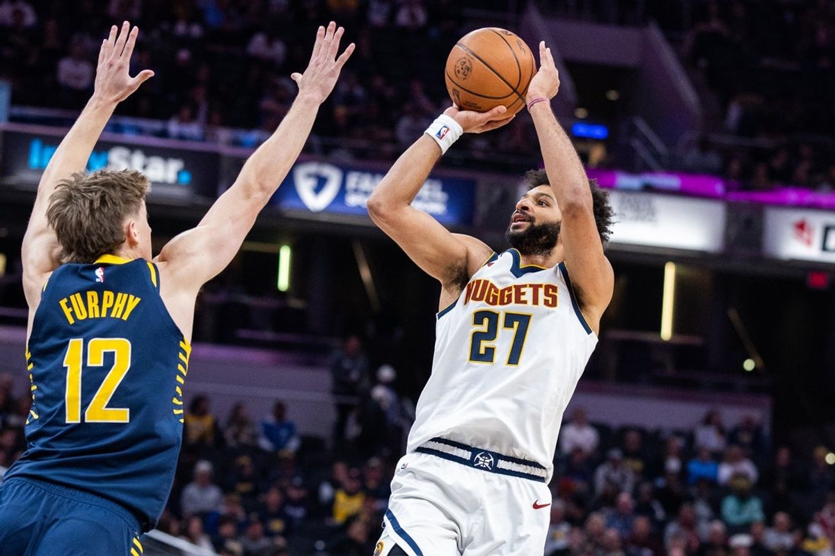 Dec 3, 2025; Indianapolis, Indiana, USA; Denver Nuggets guard Jamal Murray (27) shoots the ball while Indiana Pacers guard Johnny Furphy (12) defends in the first  half at Gainbridge Fieldhouse. Mandatory Credit: Trevor Ruszkowski-Imagn Images