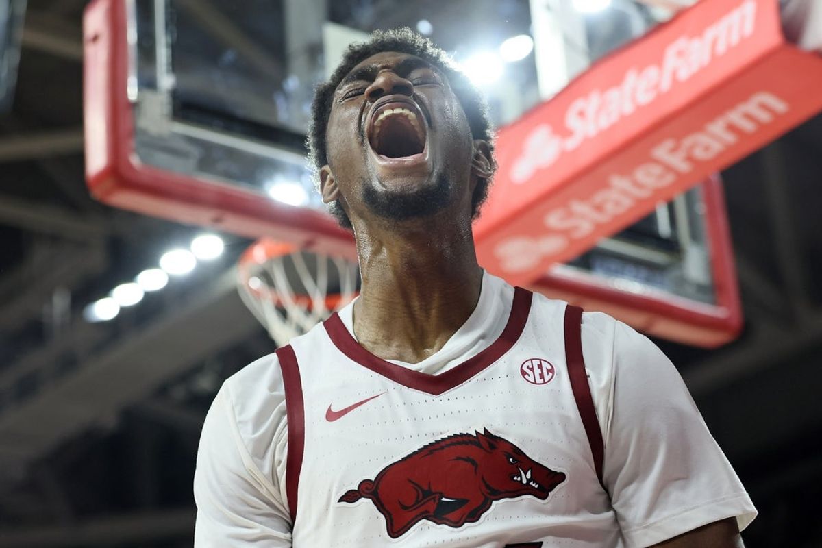 Dec 3, 2025; Fayetteville, Arkansas, USA; Arkansas Razorbacks wing Billy Richmond III (24) reacts after a dunk in the first half against the Louisville Cardinals at Bud Walton Arena. Mandatory Credit: Nelson Chenault-Imagn Images