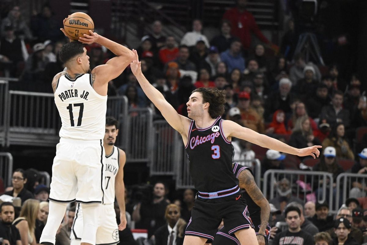 Dec 3, 2025; Chicago, Illinois, USA;  Brooklyn Nets forward Michael Porter Jr. (17) shoots against Chicago Bulls guard Josh Giddey (3) during the first half at the United Center. Mandatory Credit: Matt Marton-Imagn Images