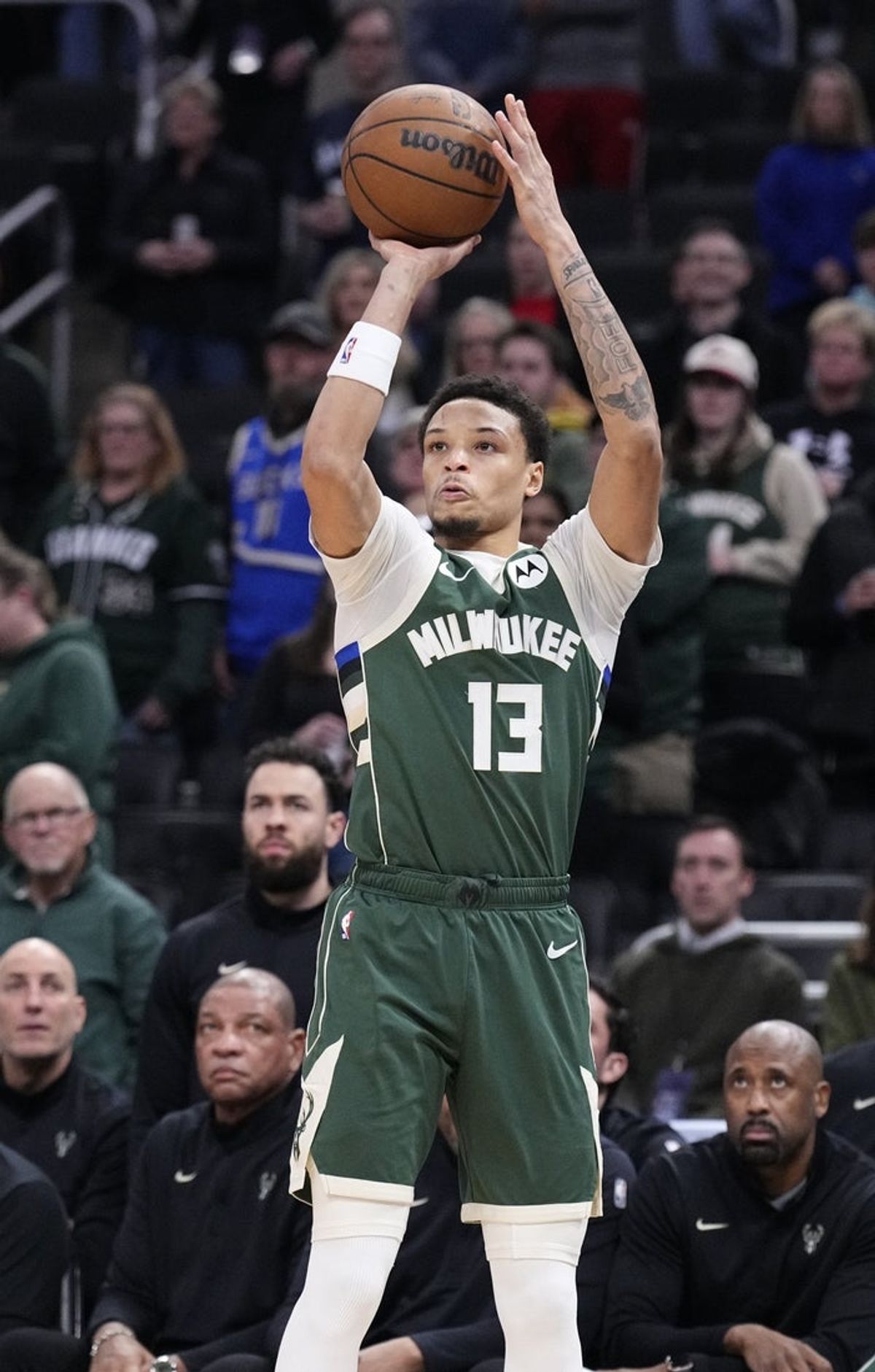 Dec 3, 2025; Milwaukee, Wisconsin, USA; Milwaukee Bucks guard Ryan Rollins (13) puts up a shot against the Detroit Pistons in the first half at Fiserv Forum. Mandatory Credit: Michael McLoone-Imagn Images