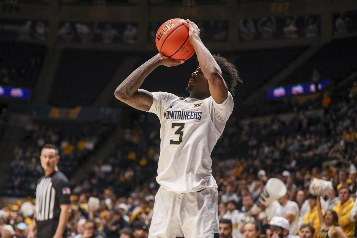 Dec 3, 2025; Morgantown, West Virginia, USA; West Virginia Mountaineers guard Honor Huff (3) shoots a three pointer during the second half against the Coppin State Eagles at Hope Coliseum. Mandatory Credit: Ben Queen-Imagn Images