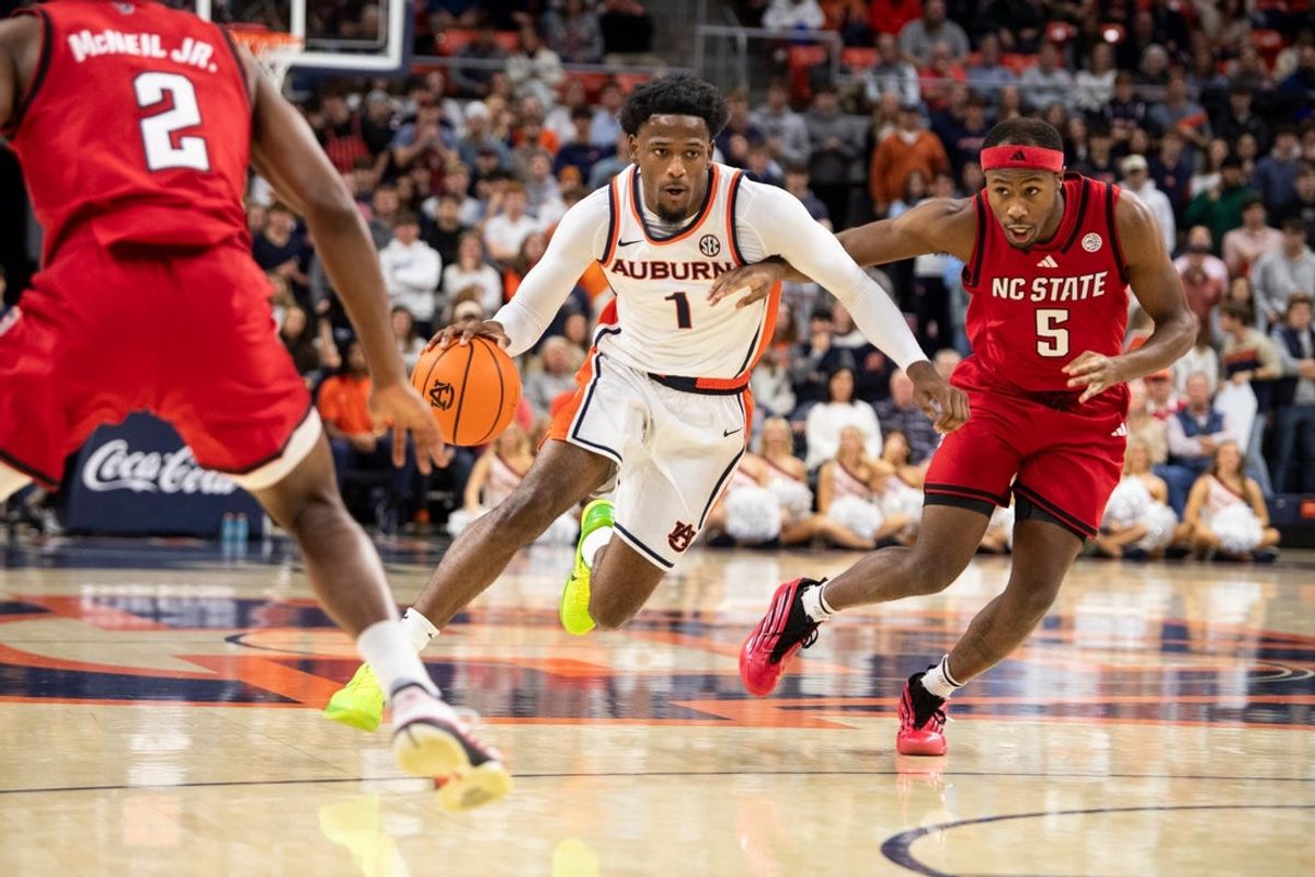 Auburn Tigers guard Kevin Overton (1) drives the ball as Auburn Tigers take on NC State Wolfpack at Neville Arena in Auburn, Ala. on Wednesday, Dec. 3, 2025.
