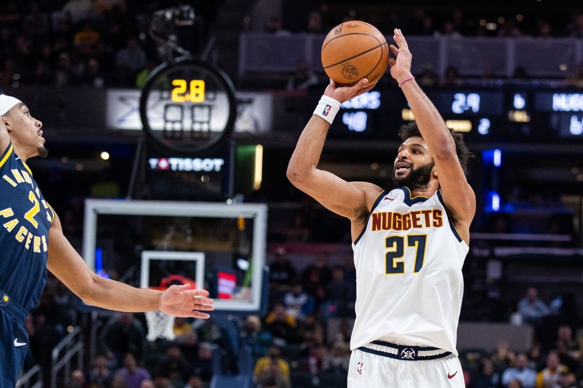 Dec 3, 2025; Indianapolis, Indiana, USA; Denver Nuggets guard Jamal Murray (27) shoots the ball while Indiana Pacers guard Andrew Nembhard (2) defends in the first  half at Gainbridge Fieldhouse. Mandatory Credit: Trevor Ruszkowski-Imagn Images