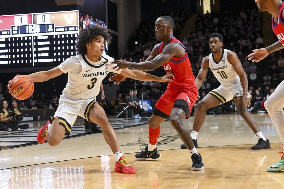 Dec 3, 2025; Nashville, Tennessee, USA;  Vanderbilt Commodores guard Tyler Tanner (3) dribbles past Southern Methodist University Mustangs guard Boopie Miller (2) during the first half at Memorial Gymnasium. Mandatory Credit: Steve Roberts-Imagn Images