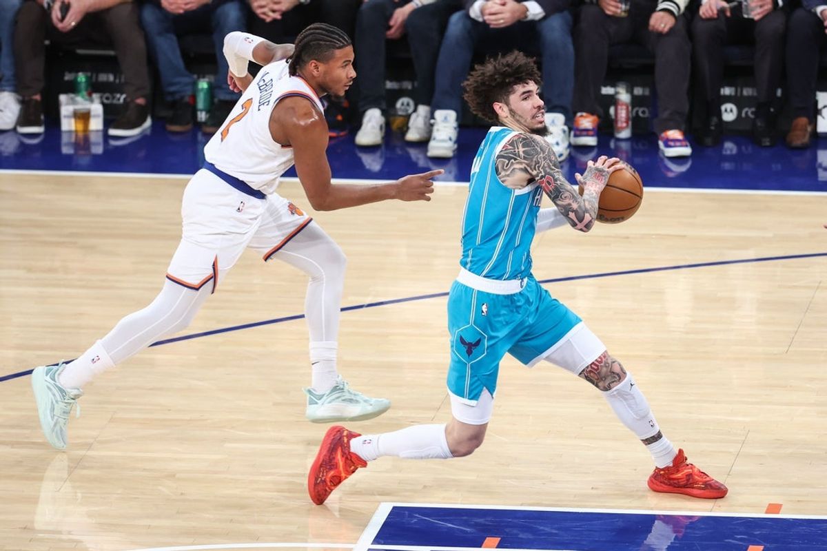 Dec 3, 2025; New York, New York, USA;  Charlotte Hornets guard LaMelo Ball (1) drives past New York Knicks guard Miles McBride (2) in the first quarter at Madison Square Garden. Mandatory Credit: Wendell Cruz-Imagn Images