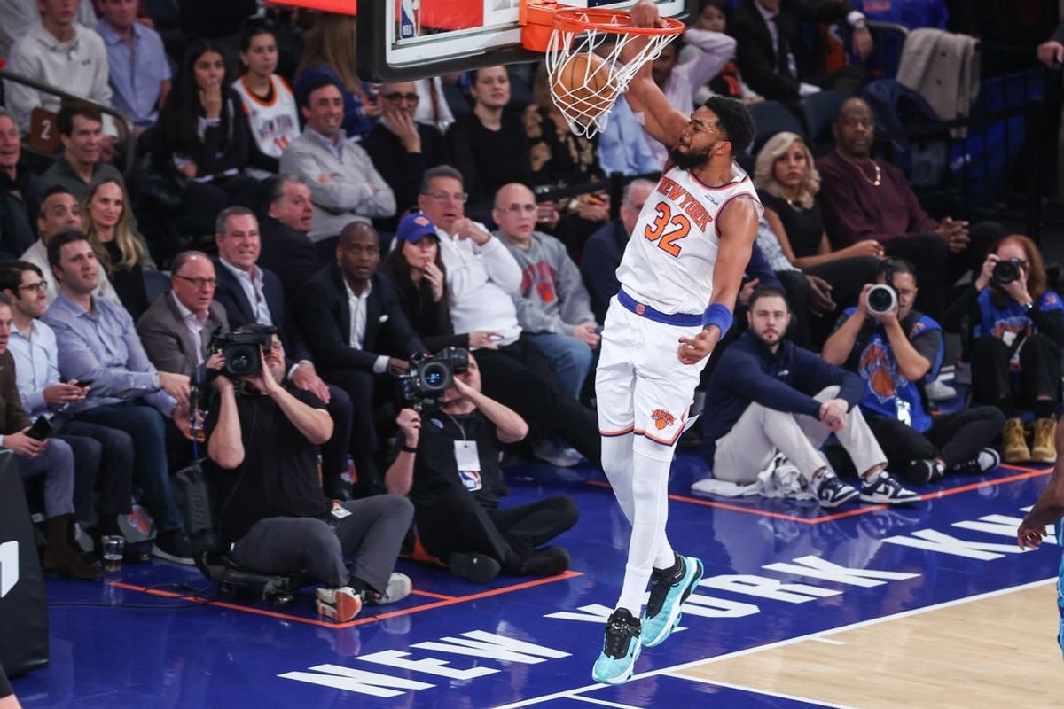 Dec 3, 2025; New York, New York, USA;  New York Knicks center Karl-Anthony Towns (32) dunks in the first quarter against the Charlotte Hornets at Madison Square Garden. Mandatory Credit: Wendell Cruz-Imagn Images