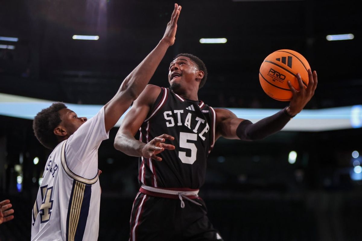 Dec 3, 2025; Atlanta, Georgia, USA; Mississippi State Bulldogs guard Shawn Jones Jr. (5) shoots over Georgia Tech Yellow Jackets forward Kowacie Reeves Jr. (14) in the first half at McCamish Pavilion. Mandatory Credit: Brett Davis-Imagn Images