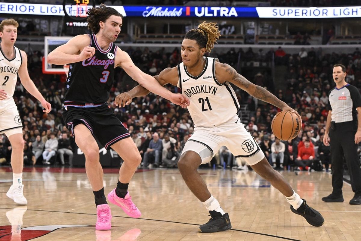 Dec 3, 2025; Chicago, Illinois, USA;  Brooklyn Nets forward Noah Clowney (21) dribbles against Chicago Bulls guard Josh Giddey (3) during the second half at the United Center. Mandatory Credit: Matt Marton-Imagn Images