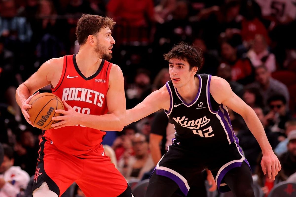 Dec 3, 2025; Houston, Texas, USA; Houston Rockets center Alperen Sengun (28) handles the ball against Sacramento Kings center Maxime Raynaud (42) during the third quarter at Toyota Center. Mandatory Credit: Erik Williams-Imagn Images