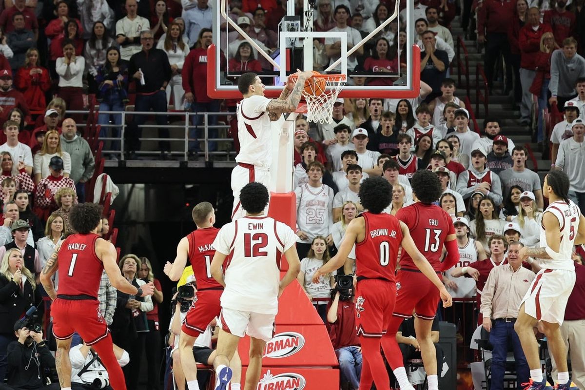 Dec 3, 2025; Fayetteville, Arkansas, USA; Arkansas Razorbacks forward Trevon Brazile (7) dunks against the Louisville Cardinals during the second half at Bud Walton Arena. Arkansas won 89-80. Mandatory Credit: Nelson Chenault-Imagn Images