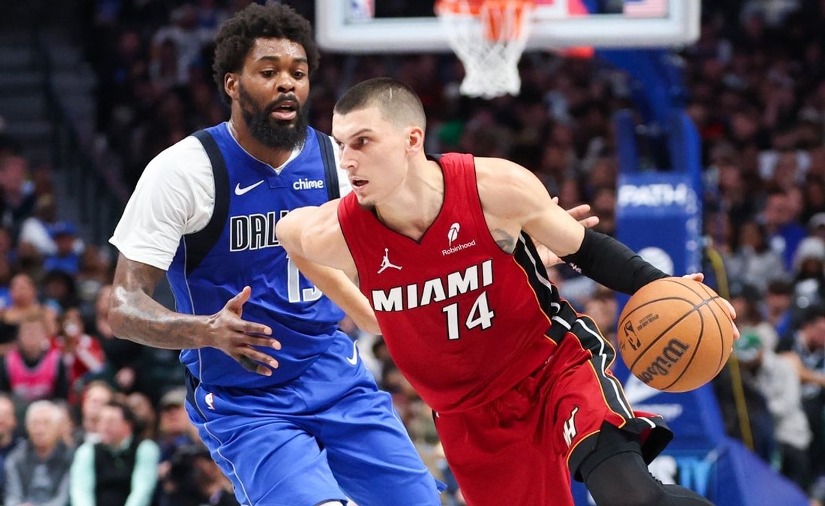 Dec 3, 2025; Dallas, Texas, USA;  Miami Heat guard Tyler Herro (14) dribbles as Dallas Mavericks forward Naji Marshall (13) defends during the second half at American Airlines Center. Mandatory Credit: Kevin Jairaj-Imagn Images