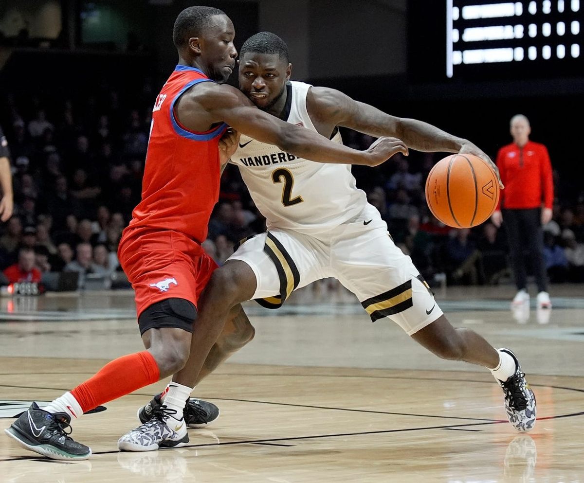 Vanderbilt guard Duke Miles (2) is defended by SMU guard Boopie Miller (2) during the second half of an NCAA college basketball game Wednesday, Dec. 3, 2025, in Nashville, Tenn. Vanderbilt won 88-69.