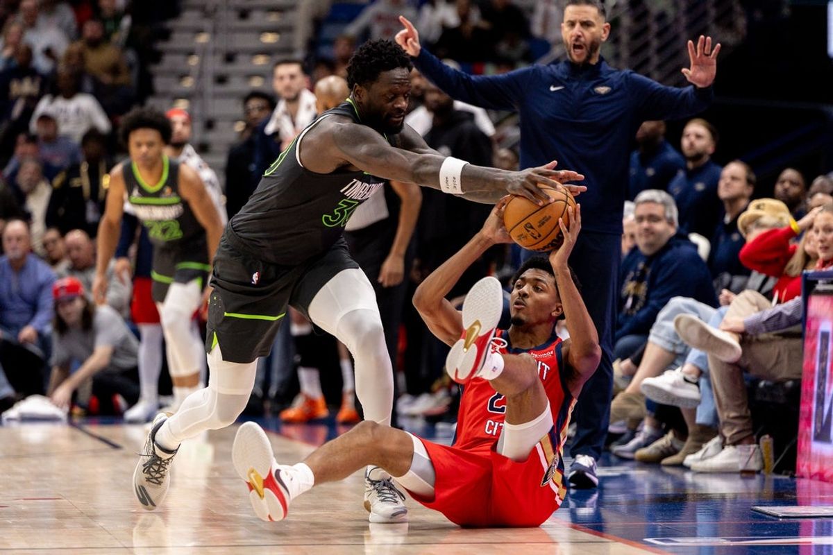 Dec 4, 2025; New Orleans, Louisiana, USA; New Orleans Pelicans forward Trey Murphy III (25) has a pass blocked by Minnesota Timberwolves forward/center Julius Randle (30) during the first half at Smoothie King Center. Mandatory Credit: Stephen Lew-Imagn Images