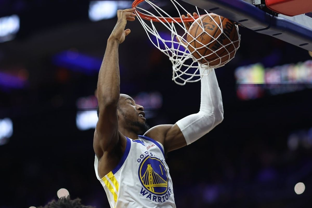 Dec 4, 2025; Philadelphia, Pennsylvania, USA; Golden State Warriors forward Jonathan Kuminga (1) dunks the ball against the Philadelphia 76ers during the third quarter at Xfinity Mobile Arena. Mandatory Credit: Bill Streicher-Imagn Images