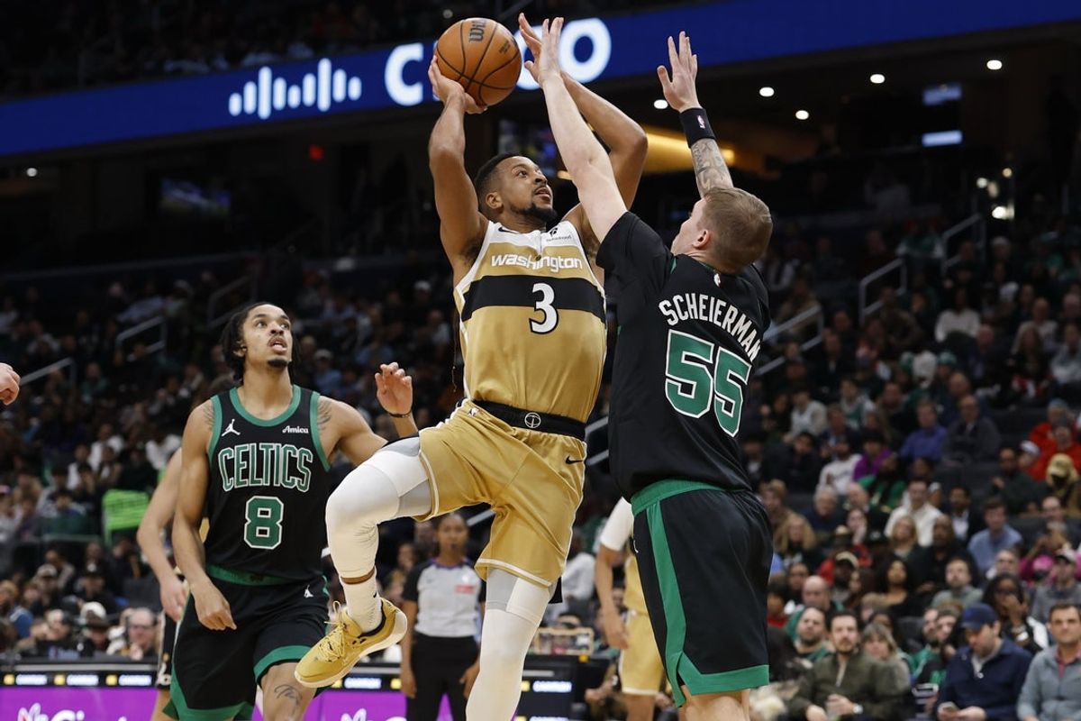 Dec 4, 2025; Washington, District of Columbia, USA; Washington Wizards guard CJ McCollum (3) shoots the ball as Boston Celtics guard Baylor Scheierman (55) defends in the second half at Capital One Arena. Mandatory Credit: Geoff Burke-Imagn Images