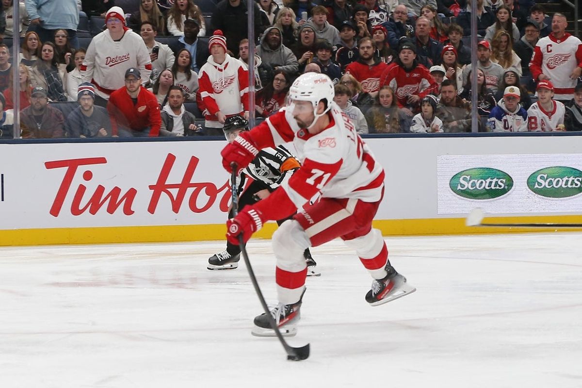 Dec 4, 2025; Columbus, Ohio, USA; Detroit Red Wings center Dylan Larkin (71) wrists a shot on goal against the Columbus Blue Jackets during the third period at Nationwide Arena. Mandatory Credit: Russell LaBounty-Imagn Images
