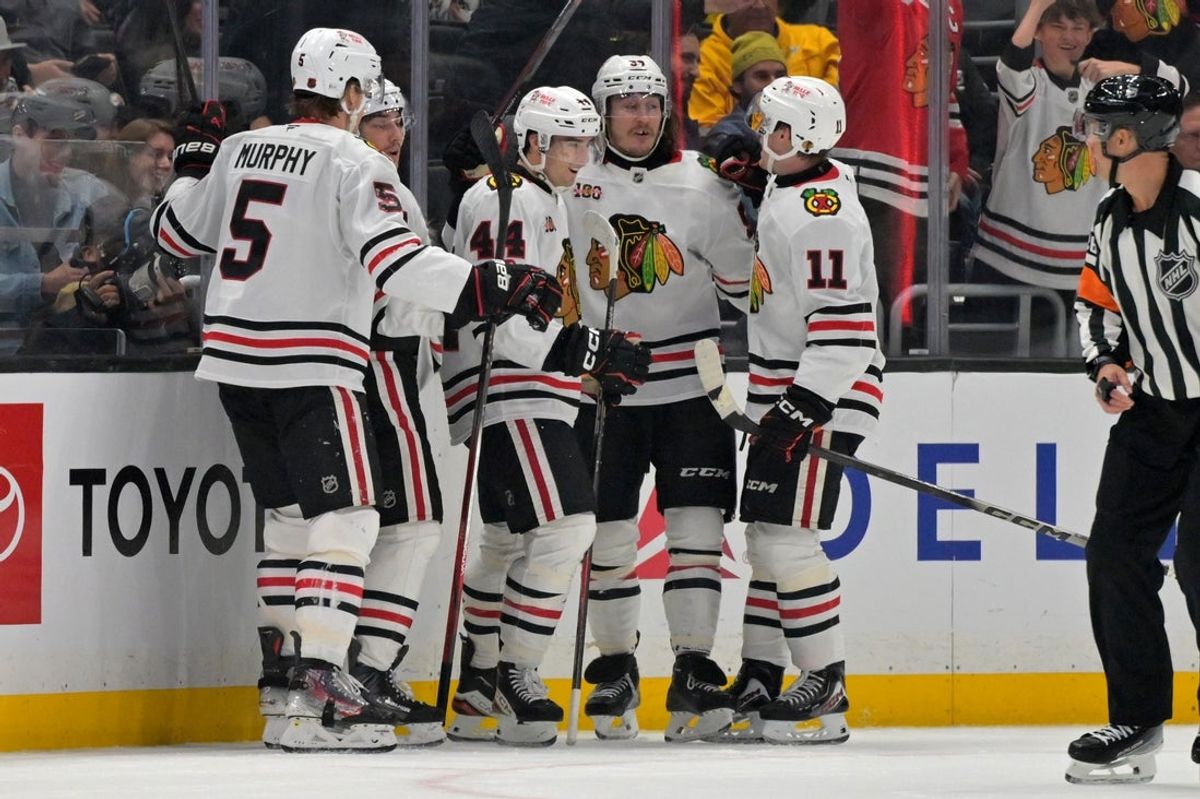 Dec 4, 2025; Los Angeles, California, USA;  Chicago Blackhawks defenseman Wyatt Kaiser (44) is congratulated after scoring a goal during the second period against the Los Angeles Kings at Crypto.com Arena. Mandatory Credit: Jayne Kamin-Oncea-Imagn Images