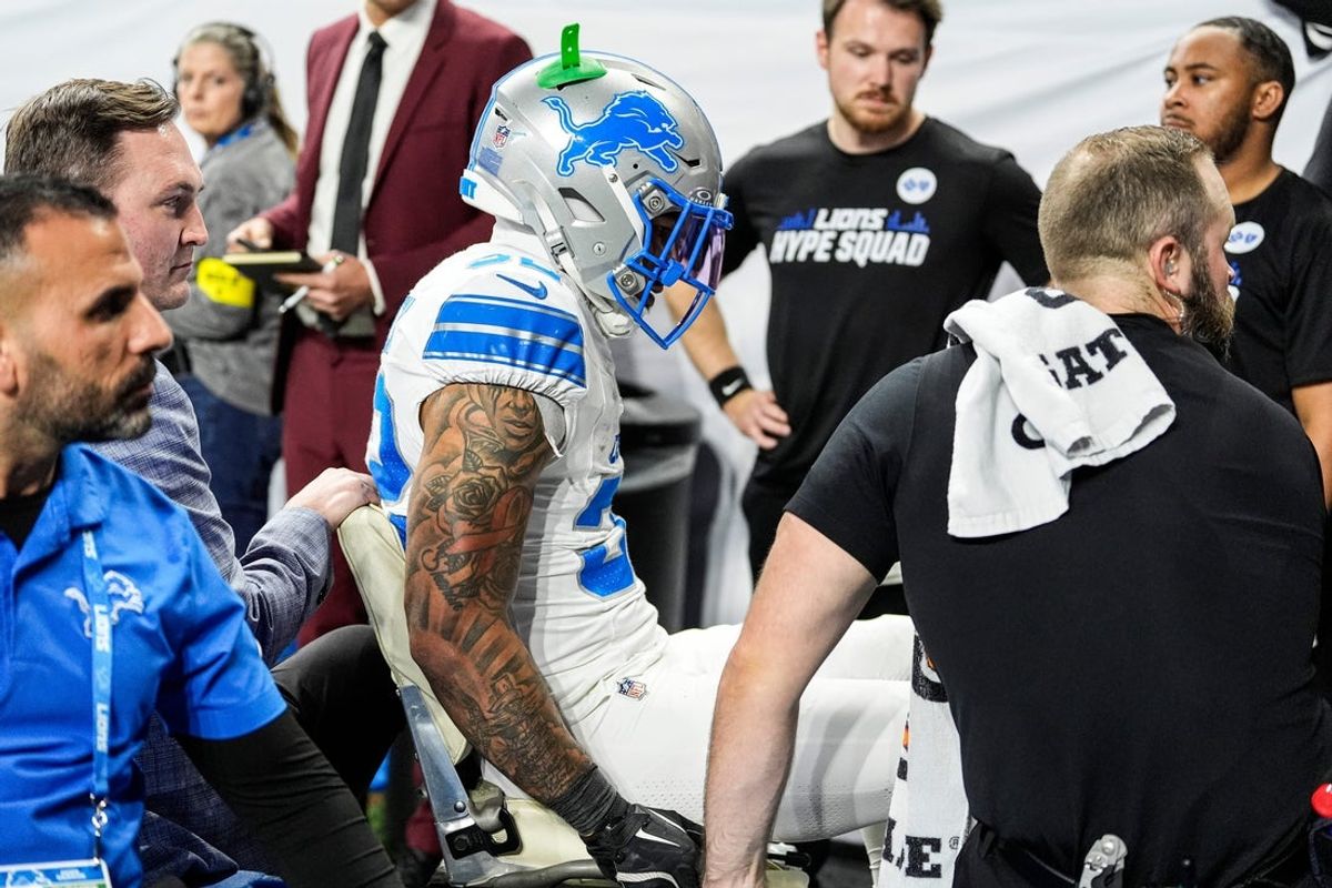 Detroit Lions safety Brian Branch (32) is carted off the field due to injury during the second half against Dallas Cowboys at Ford Field in Detroit on Thursday, Dec. 4, 2025.