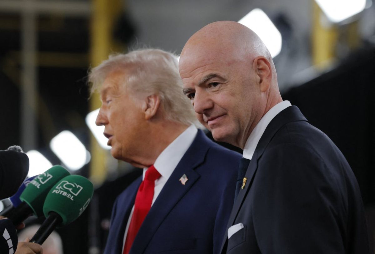 Dec 5, 2025; Washington, District of Columbia, USA; FIFA President Gianni Infantino and United States of America President Donald Trump speak to media as they arrive on the red carpet ahead of the FIFA World Cup 2026 Final Draw at John F. Kennedy Center for the Performing Arts. Mandatory Credit: Brian Snyder-Reuters via Imagn Images