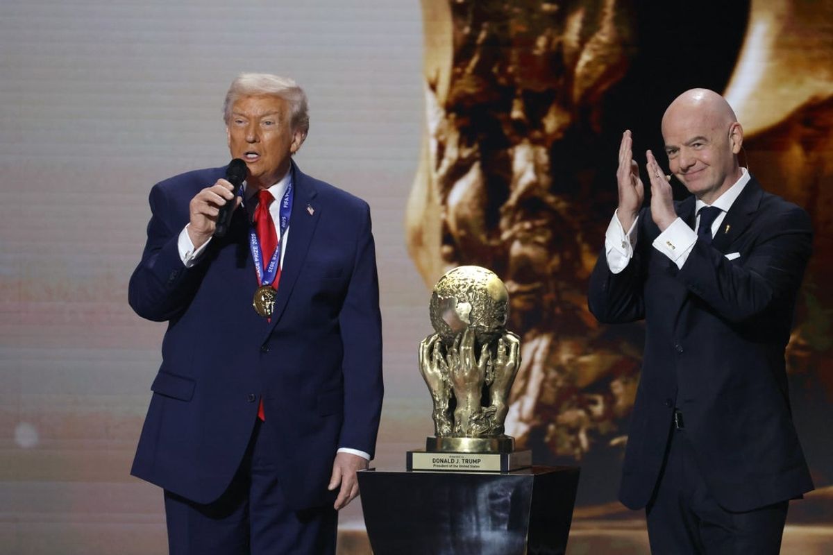 Dec 5, 2025; Washington, District of Columbia, USA; FIFA president Gianni Infantino presents United States president Donald Trump with the FIFA Peace Prize during the FIFA World Cup 2026 Final Draw at John F. Kennedy Center for the Performing Arts. Mandatory Credit: Amber Searls-Imagn Images