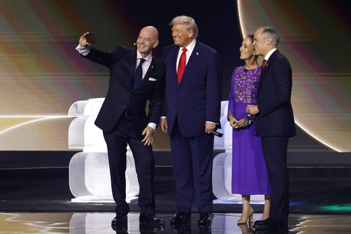 Dec 5, 2025; Washington, District of Columbia, USA; FIFA president Gianni Infantino, United States president Donald Trump, Mexico president Claudia Sheinbaum, and Canada prime minister Mark Carney take a selfie on stage during the FIFA World Cup 2026 Final Draw at John F. Kennedy Center for the Performing Arts. Mandatory Credit: Amber Searls-Imagn Images