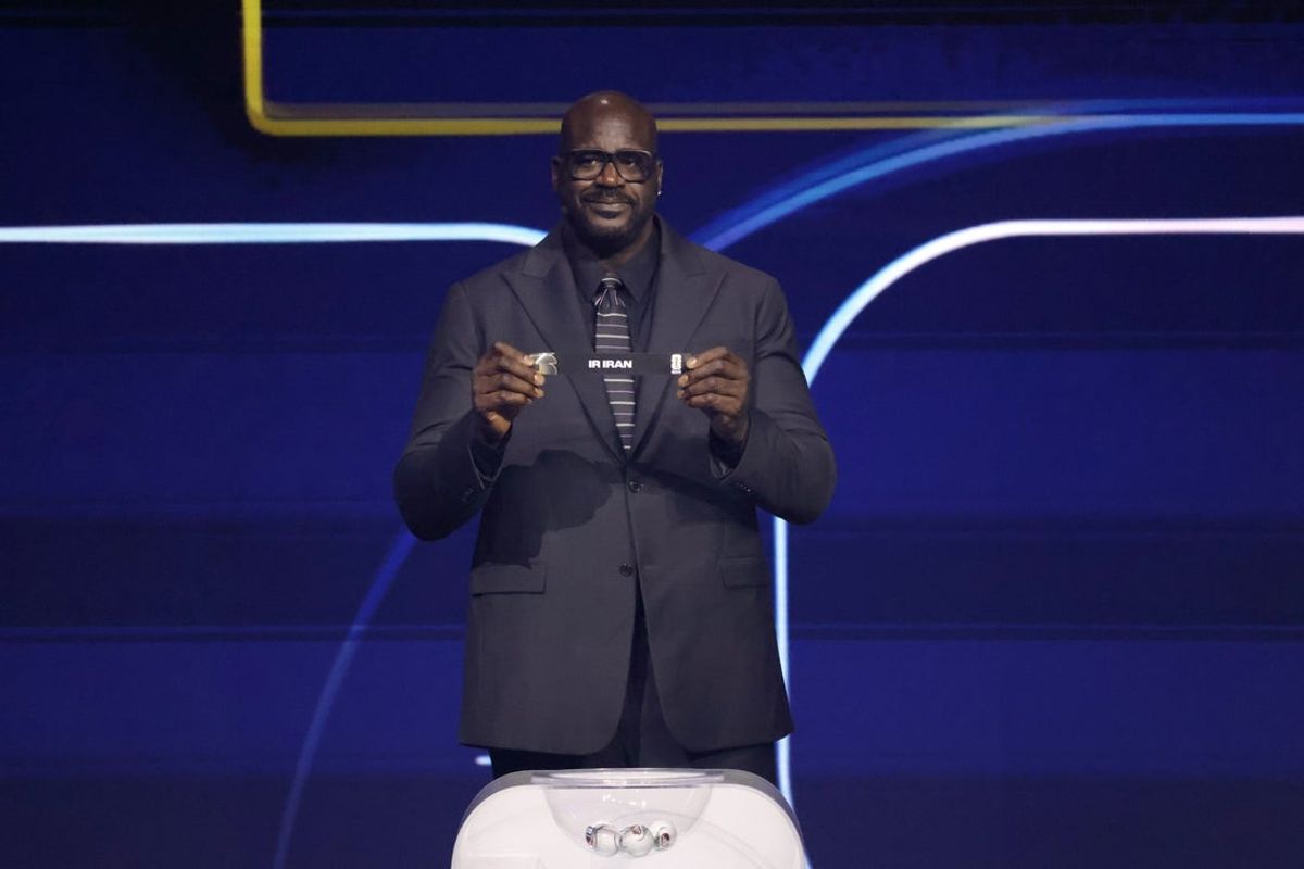 Dec 5, 2025; Washington, District of Columbia, USA; Shaquille O'Neal draws the card of Iran for Group G during the FIFA World Cup 2026 Final Draw at John F. Kennedy Center for the Performing Arts. Mandatory Credit: Amber Searls-Imagn Images