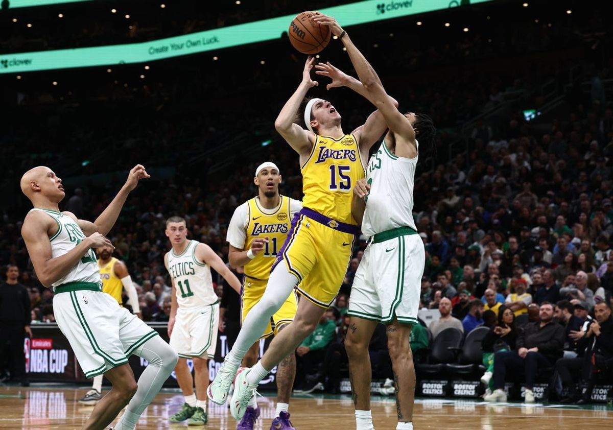 Dec 5, 2025; Boston, Massachusetts, USA; Boston Celtics forward Josh Minott (8) blocks a shot by Los Angeles Lakers guard Austin Reaves (15) during the first half at TD Garden. Mandatory Credit: Winslow Townson-Imagn Images