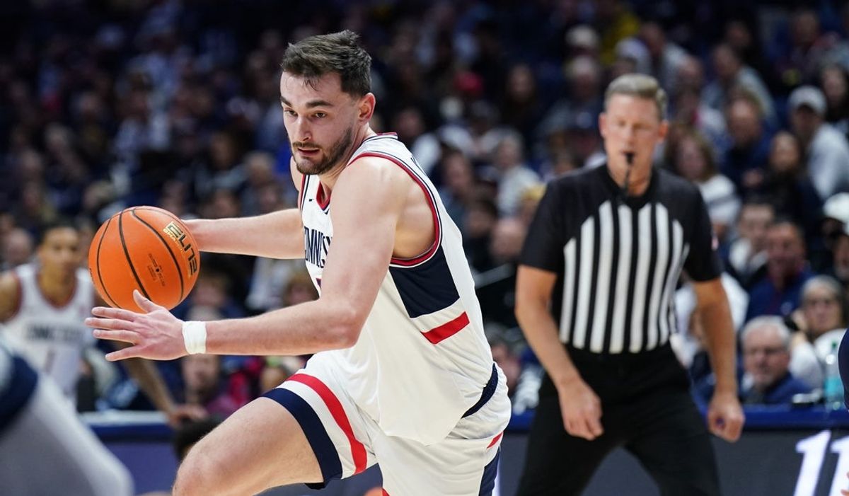 Dec 5, 2025; Storrs, Connecticut, USA; UConn Huskies forward Alex Karaban (11) drives the ball against the East Texas A&M Lions in the first half at Harry A. Gampel Pavilion. Mandatory Credit: David Butler II-Imagn Images