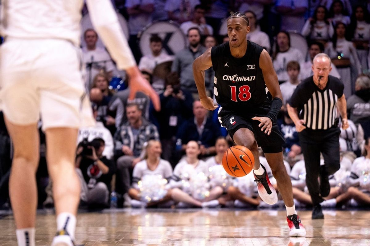 Cincinnati Bearcats forward Baba Miller (18) takes the ball down court in the first half of the NCAA basketball game between Cincinnati Bearcats and Xavier Musketeers at the Cintas Center in Cincinnati on Dec. 5, 2025.
