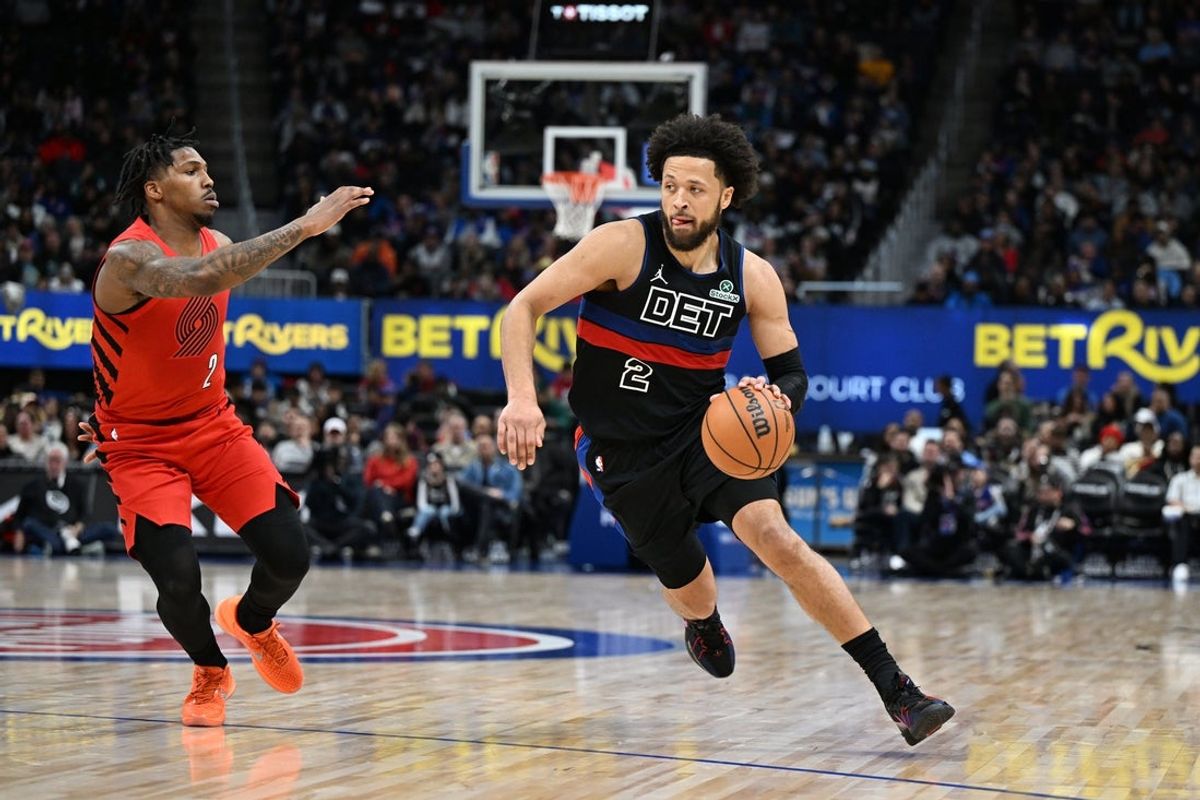 Dec 5, 2025; Detroit, Michigan, USA;  Detroit Pistons guard Cade Cunningham (2) drives to the basket past Portland Trail Blazers guard Caleb Love (2) in the second quarter at Little Caesars Arena. Mandatory Credit: Lon Horwedel-Imagn Images