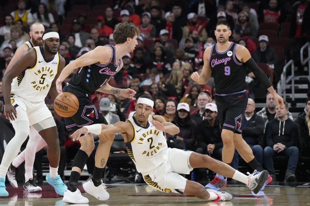 Dec 5, 2025; Chicago, Illinois, USA; Indiana Pacers guard Andrew Nembhard (2) steals the ball from Chicago Bulls forward Matas Buzelis (14) during the first half at United Center. Mandatory Credit: David Banks-Imagn Images