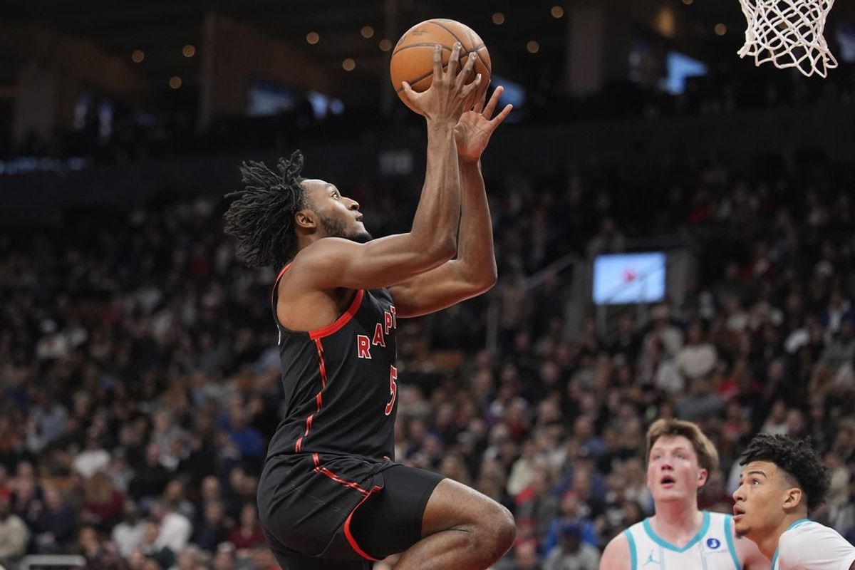 Dec 5, 2025; Toronto, Ontario, CAN; Toronto Raptors guard Immanuel Quickley (5) goes up to make a basket against the Charlotte Hornets during the first half at Scotiabank Arena. Mandatory Credit: John E. Sokolowski-Imagn Images