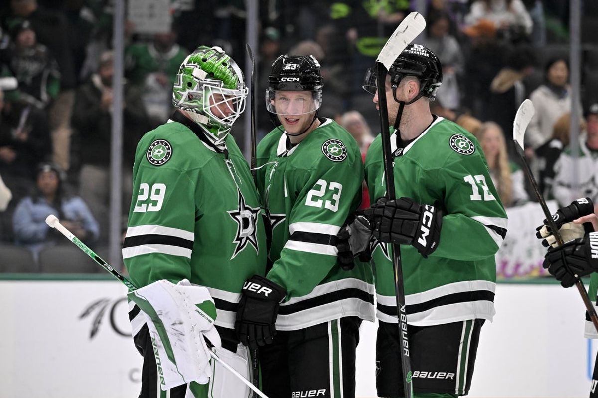 Dec 5, 2025; Dallas, Texas, USA; Dallas Stars goaltender Jake Oettinger (29) and defenseman Esa Lindell (23) celebrate the Stars win over the San Jose Sharks at the American Airlines Center. Mandatory Credit: Jerome Miron-Imagn Images