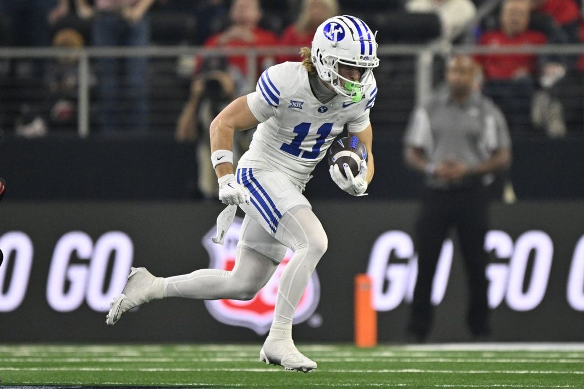 Dec 6, 2025; Arlington, TX, USA; BYU Cougars wide receiver Parker Kingston (11) runs with the ball during the first half against the Texas Tech Red Raiders at AT&T Stadium. Mandatory Credit: Jerome Miron-Imagn Images