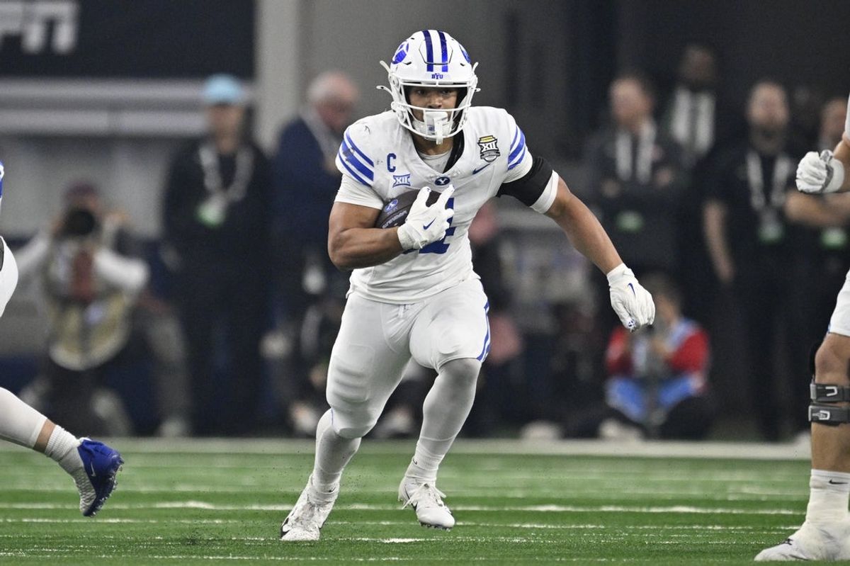 Dec 6, 2025; Arlington, TX, USA; BYU Cougars running back LJ Martin (4) runs with the ball during the first half against the Texas Tech Red Raiders at AT&T Stadium. Mandatory Credit: Jerome Miron-Imagn Images