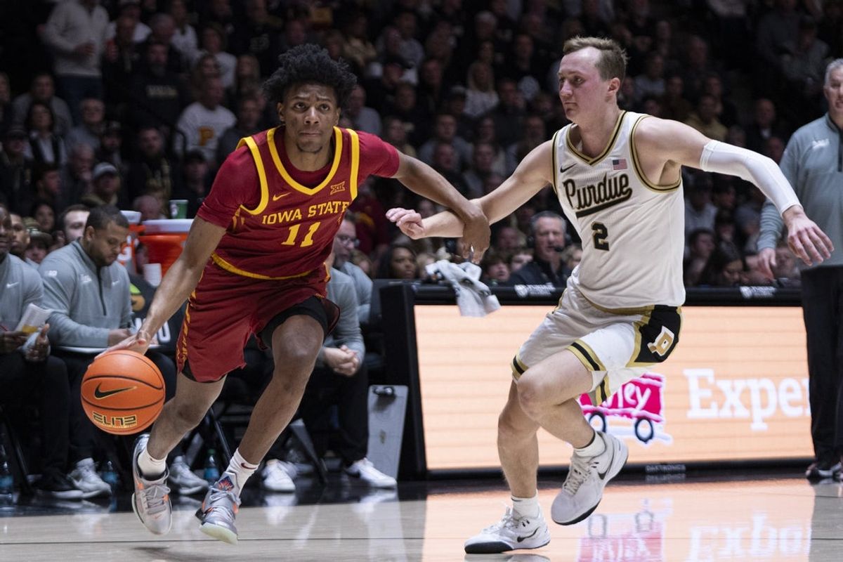Dec 6, 2025; West Lafayette, Indiana, USA; Iowa State Cyclones guard Dominick Nelson (11) dribbles past Purdue Boilermakers guard Fletcher Loyer (2) during the first half at Mackey Arena. Mandatory Credit: Jacob Musselman-Imagn Images