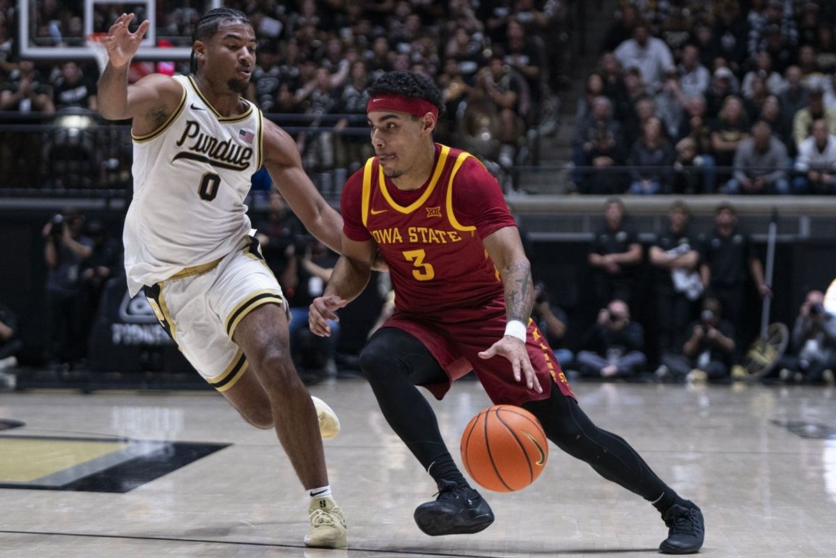 Dec 6, 2025; West Lafayette, Indiana, USA; Iowa State Cyclones guard Tamin Lipsey (3) dribbles past Purdue Boilermakers guard C.J. Cox (0) during the first half at Mackey Arena. Mandatory Credit: Jacob Musselman-Imagn Images