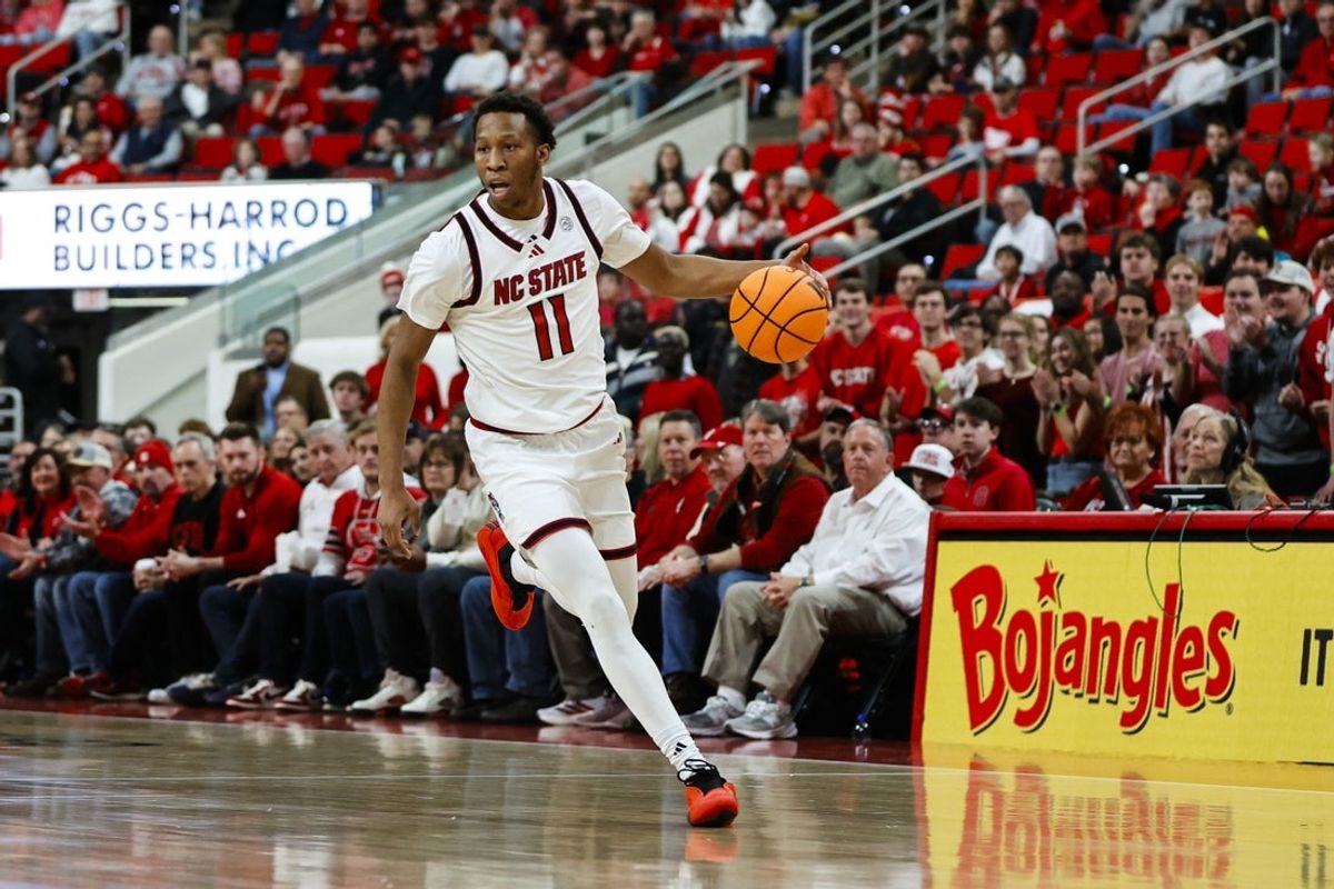 Dec 6, 2025; Raleigh, North Carolina, USA; NC State Wolfpack guard Quadir Copeland (11) dribbles down the court during the first half of the game against UNC Asheville Bulldogs at Lenovo Center. Mandatory Credit: Jaylynn Nash-Imagn Images