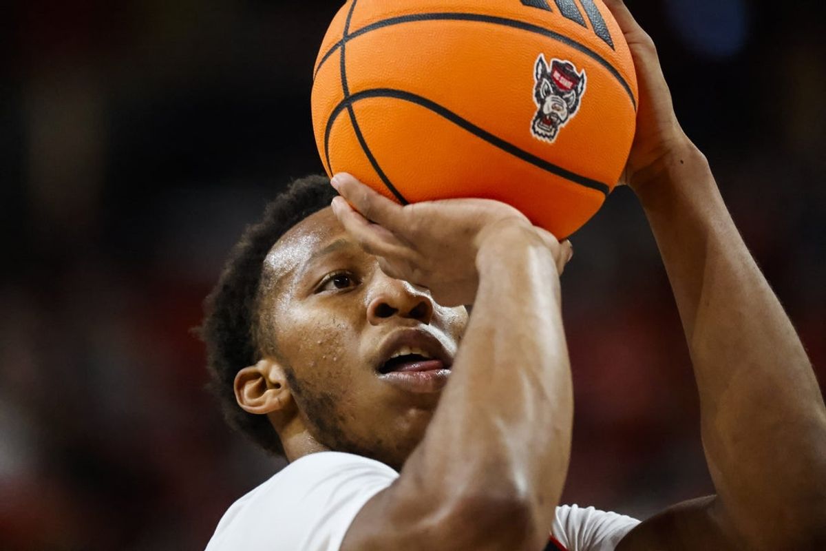 Dec 6, 2025; Raleigh, North Carolina, USA; NC State Wolfpack guard Quadir Copeland (11) shoots a free throw during the first half of the game against UNC Asheville Bulldogs at Lenovo Center. Mandatory Credit: Jaylynn Nash-Imagn Images