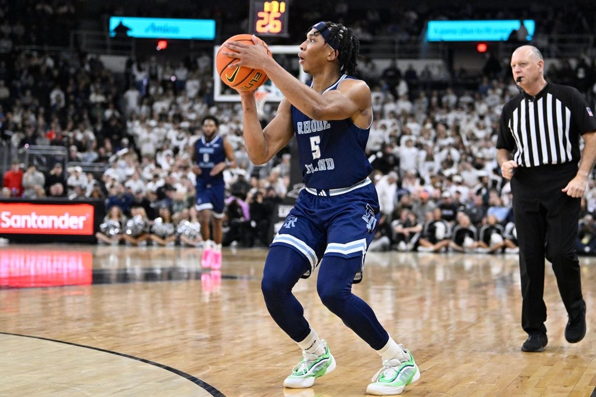 Dec 6, 2025; Providence, Rhode Island, USA; Rhode Island Rams guard Jonah Hinton (5) shoots a three point basket during the second half against the Providence Friars at Amica Mutual Pavilion. Mandatory Credit: Eric Canha-Imagn Images