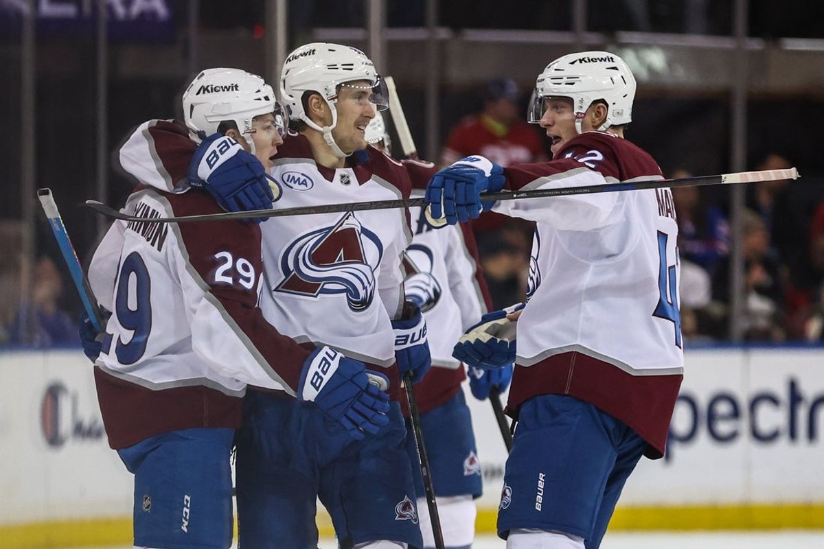Dec 6, 2025; New York, New York, USA;  Colorado Avalanche center Nathan MacKinnon (29) celebrates with his teammates after scoring a goal to defeat the New York Rangers 3-2 in overtime at Madison Square Garden. Mandatory Credit: Wendell Cruz-Imagn Images